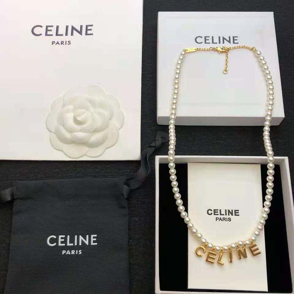 Side view showing adjustable chain and glass pearls on Celine bracelet