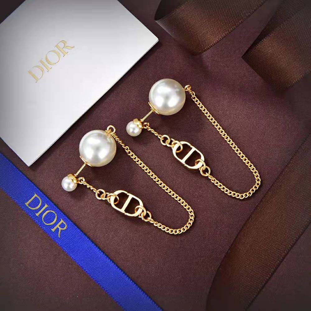 Close-up detail of gold-finish metal and white resin pearls on Dior Women 30 Tribales Earrings