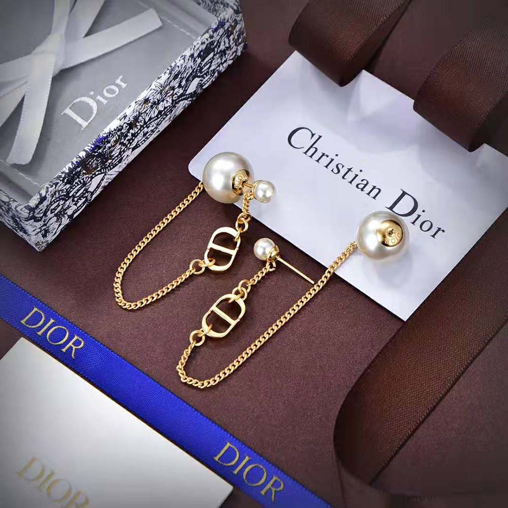 Side angle showing clip closure of Dior Women 30 Tribales Earrings in gold-finish