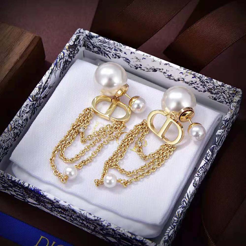 Close-up detail of gold finish and Dior logo on Dior Women Tribales Earrings