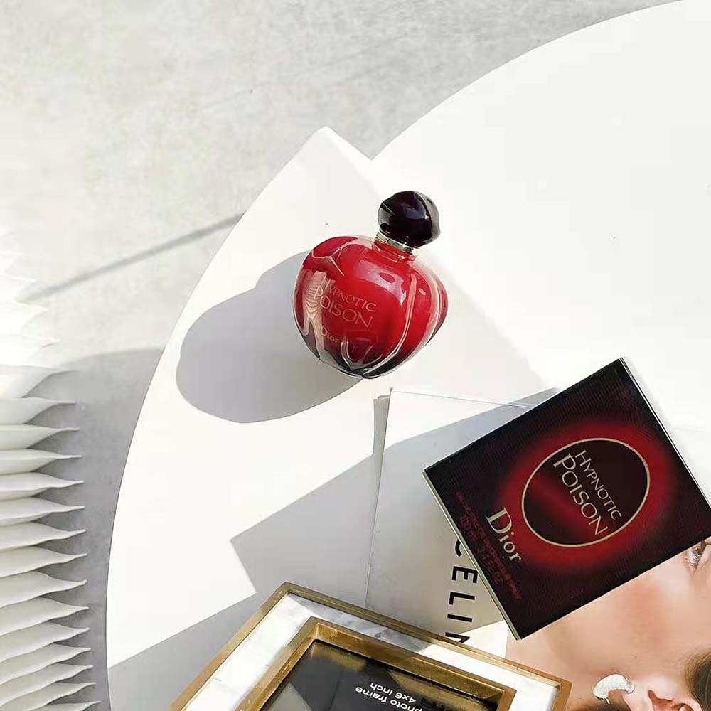 Side angle showing sleek form of Dior Women Hypnotic Poison Eau de Toilette