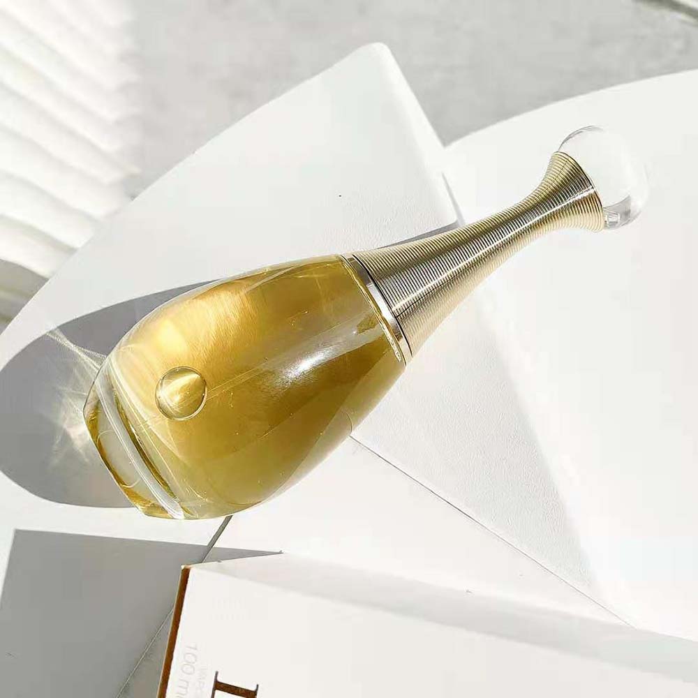 Side angle highlighting silhouette of Dior Women J’adore L’or Fragrance bottle