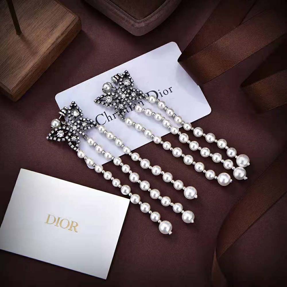 Close-up detail of butterfly design on Dior Women Papillon De Nuit Earrings