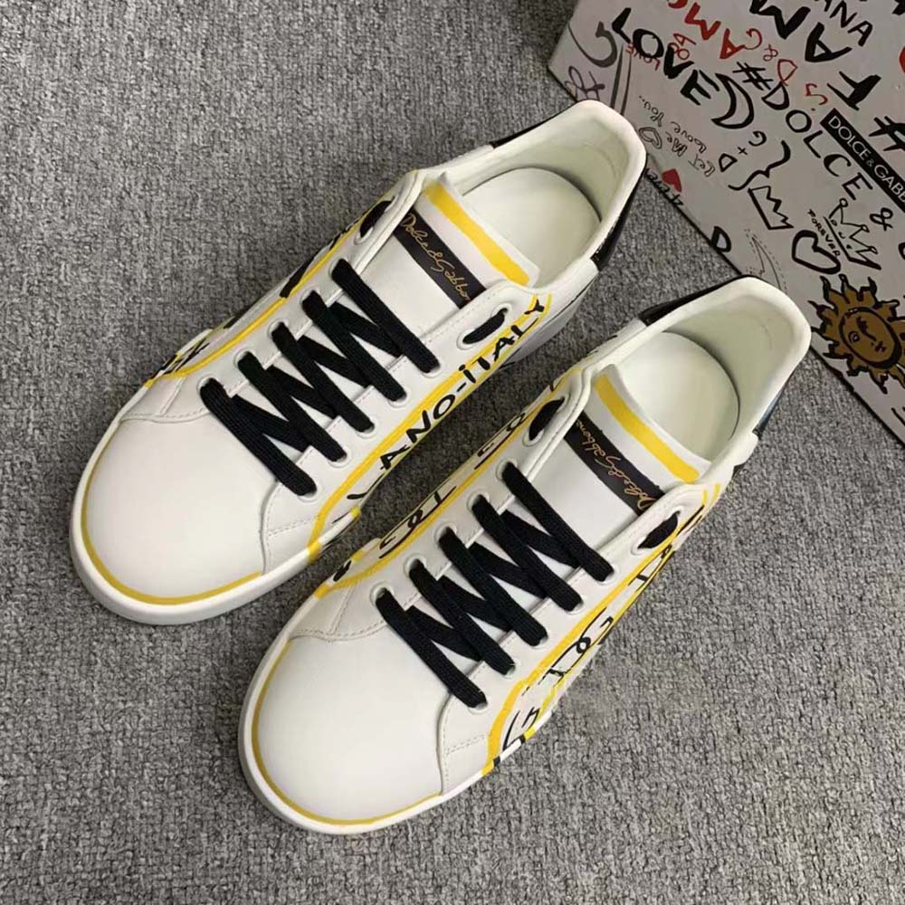 Close-up on signature D&G hardware detail of Portofino Sneakers-Yellow