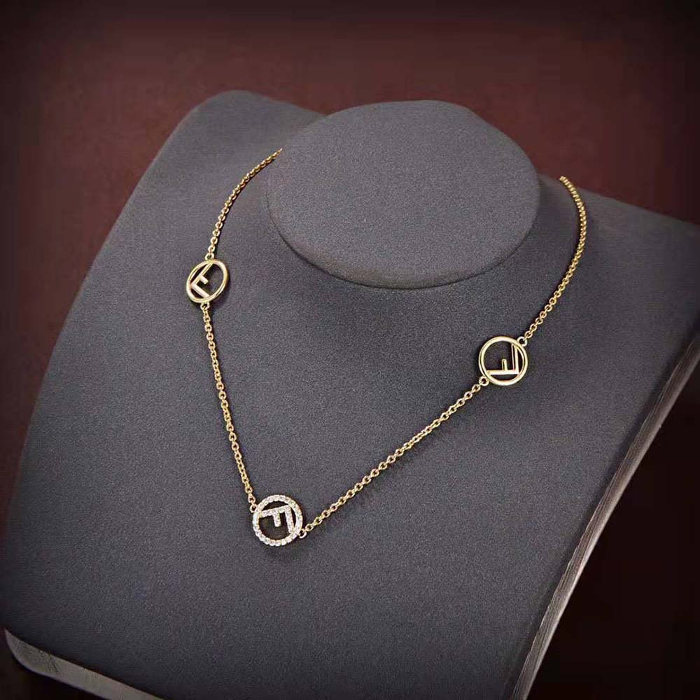 Close-up detail of gold-plated lobster clasp on Fendi necklace