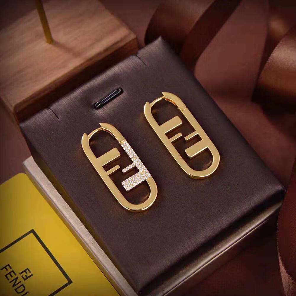 Side profile showing slim silhouette of Fendi Women O’Lock Earrings Gold-colored