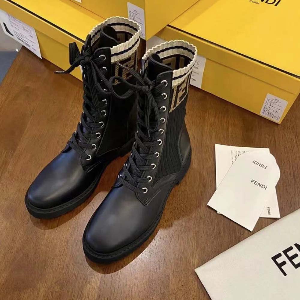Close-up of embossed Fendi hardware on Rockoko Black Leather Biker Boots