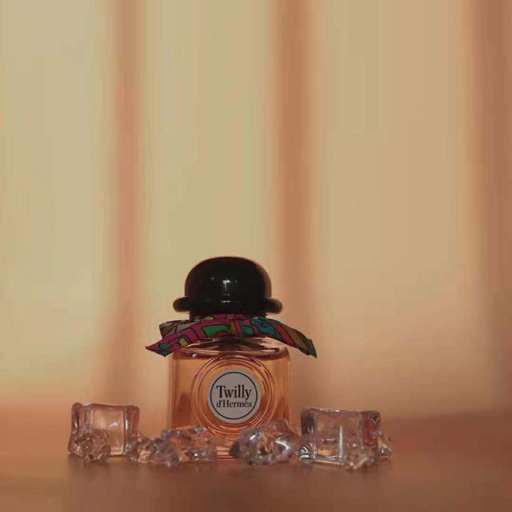Angle showing sleek compact design of Hermes Women Twilly D’hermes Eau de Parfum bottle