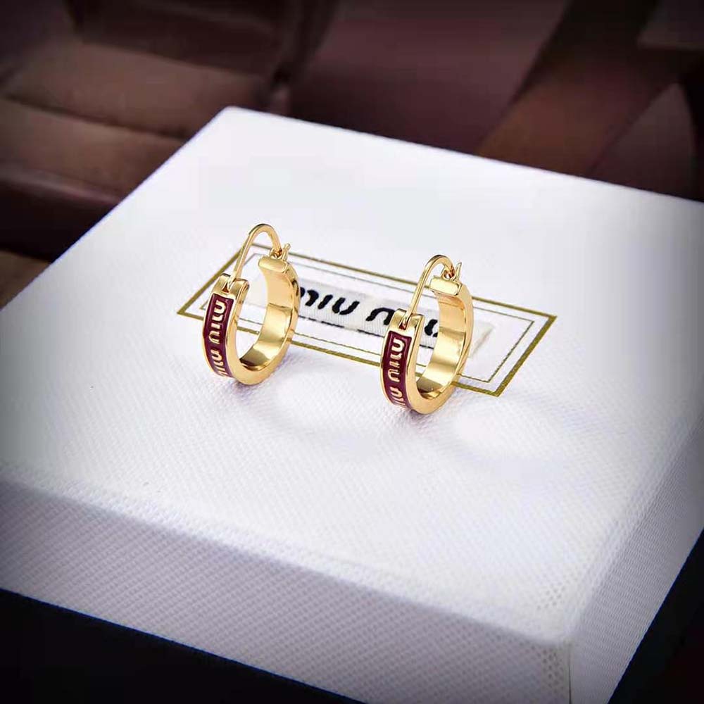 Close-up detail of red enamel finish on Miu Miu Women Enameled Metal Earrings