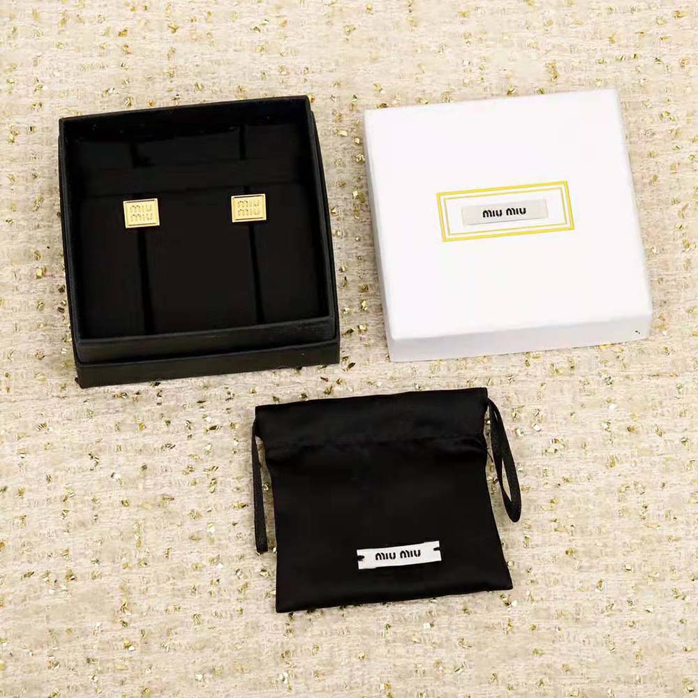 Close-up detail of engraved logo on Miu Miu Women Metal Earrings