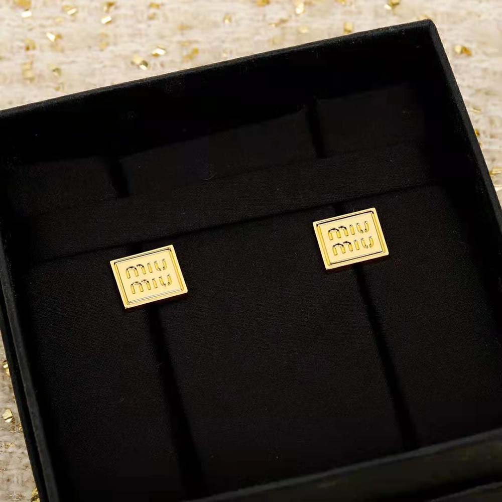 Side angle showing push-back closure on Miu Miu Metal Earrings