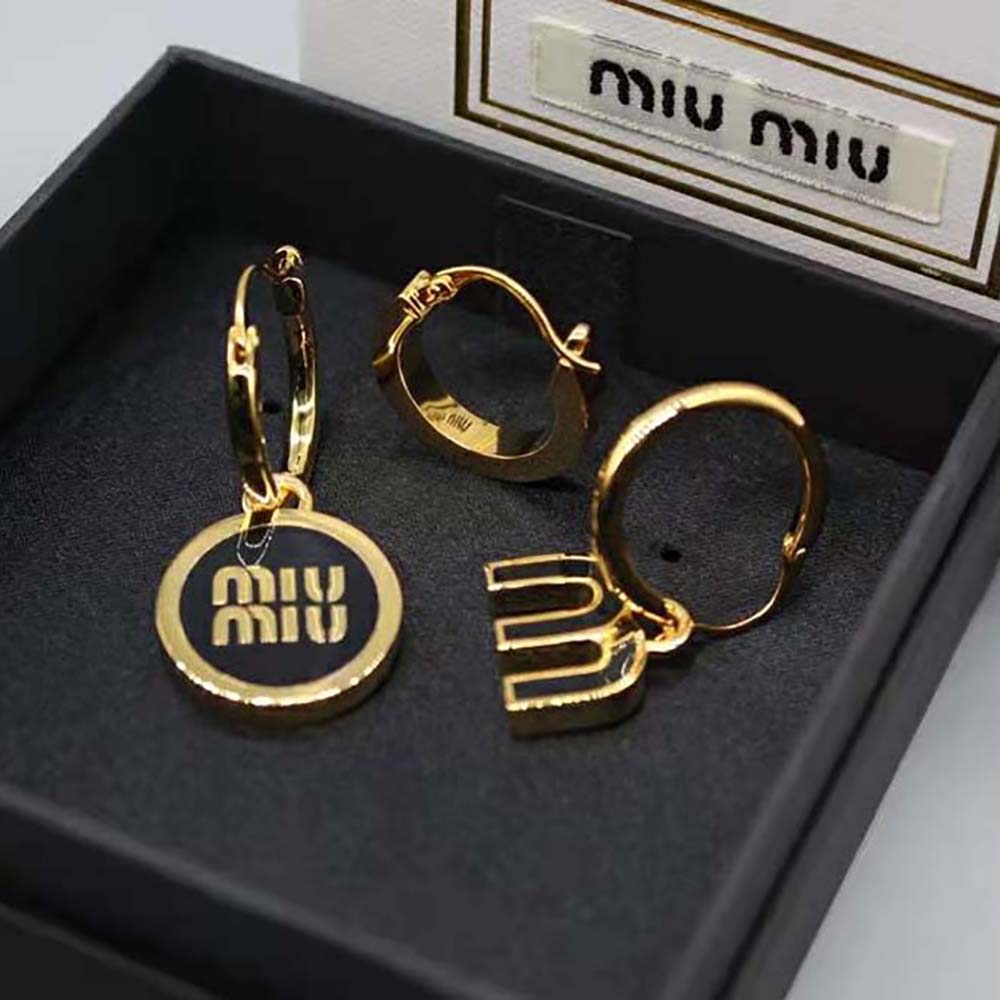 Side angle showing sleek silhouette of Miu Miu Women Set of Enameled Metal Earrings