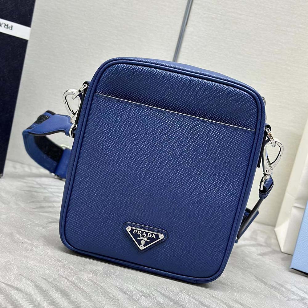 Close-up of silver-tone logo plaque on Prada Men Saffiano Leather Shoulder Bag-Navy