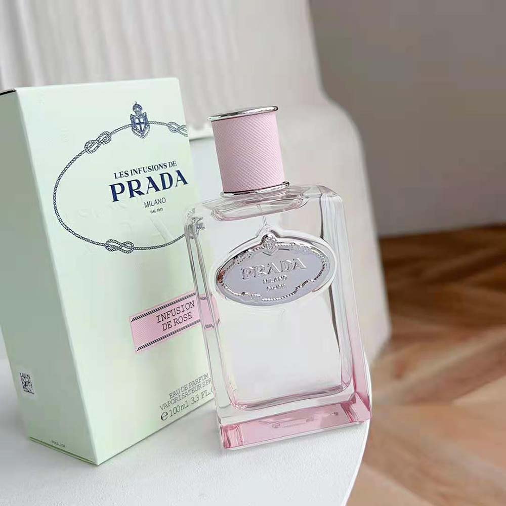 Side angle highlighting signature rose details on Prada Infusion De Rose bottle