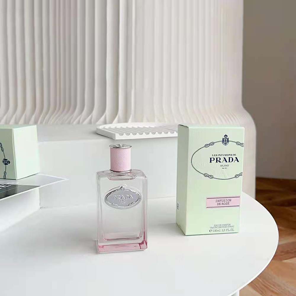 Close-up on pink glass and sleek cap of Prada Infusion De Rose