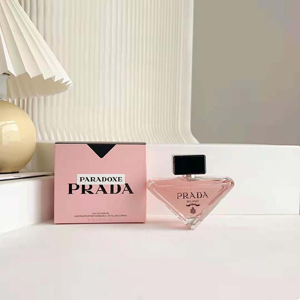 Close-up on silver cap and logo detail of Prada Paradoxe EDP
