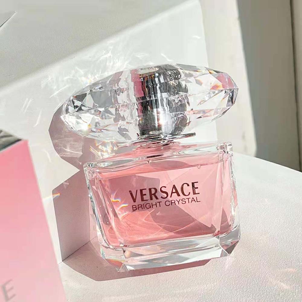 Side angle showing glossy finish of Versace Women Bright Crystal Edt 90 ml bottle