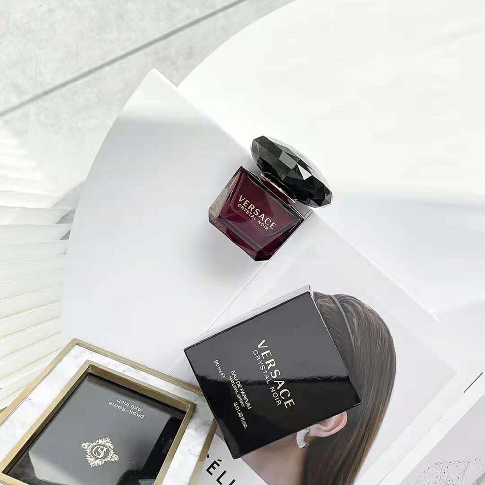 Side angle showing Versace logo detail on Crystal Noir Edt 90 ml bottle