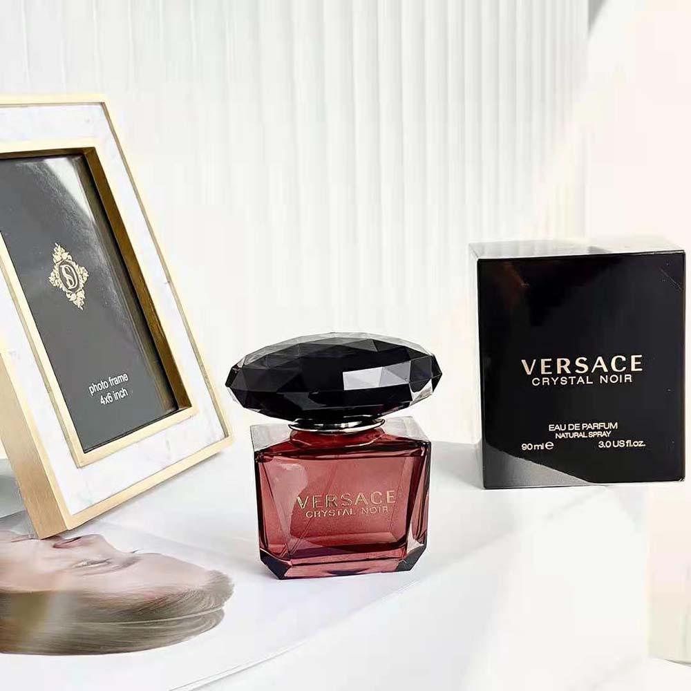 Close-up of crystal-inspired cap on Versace Women Crystal Noir Edt 90 ml
