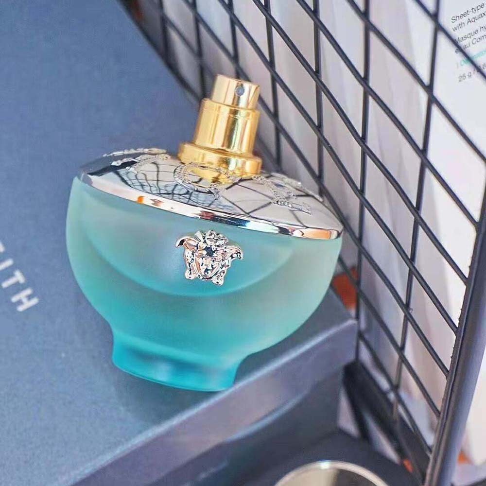 Side angle showing spray nozzle of Versace Women Dylan Turquoise Edt 100 ml bottle