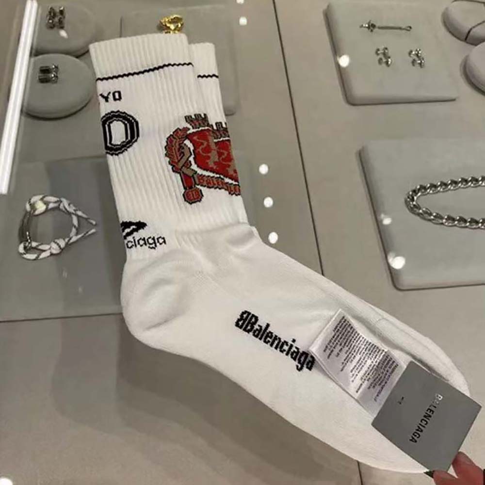 Side angle showing elastic cuff on white Tokyo Soccer Socks