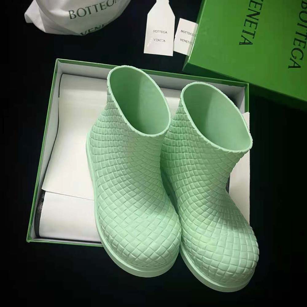 Close-up of green leather and brushed metal details on Bottega Veneta Fireman Boot