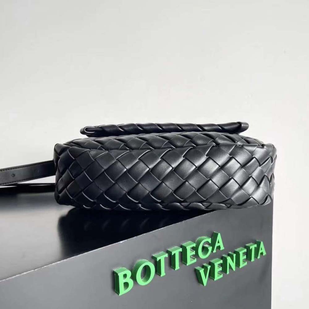 Side angle showing flap and adjustable strap on Bottega Veneta Small Cobble Messenger