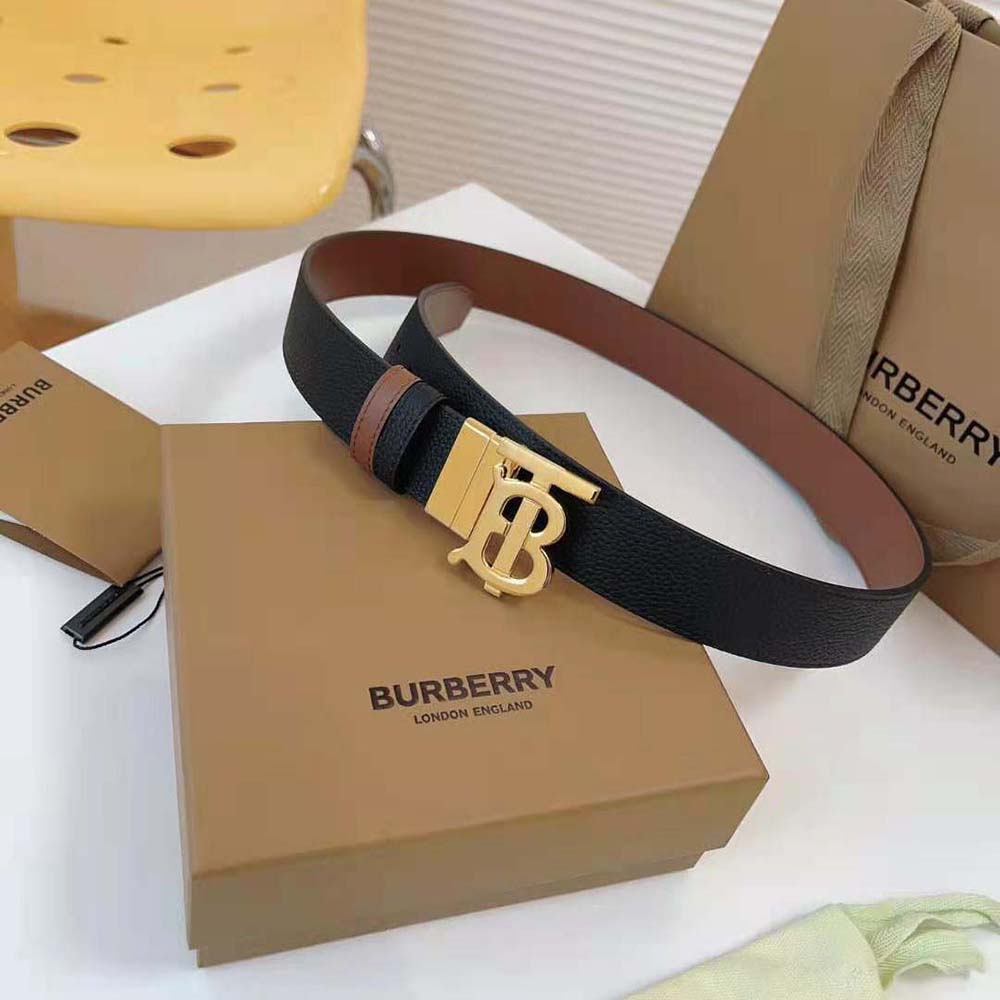 Side angle showing reversible black and light gold leather of Burberry belt