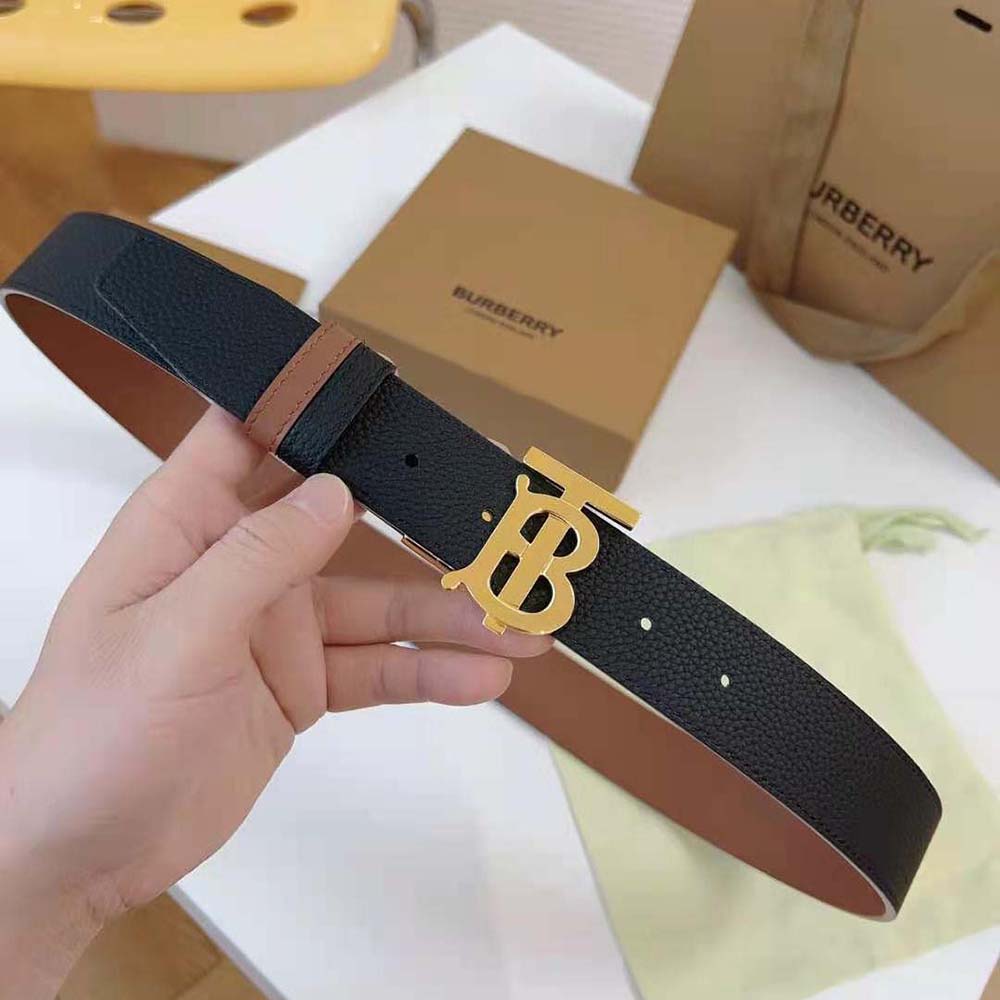Close-up of gold-tone TB buckle on Burberry Men Reversible Leather TB Belt