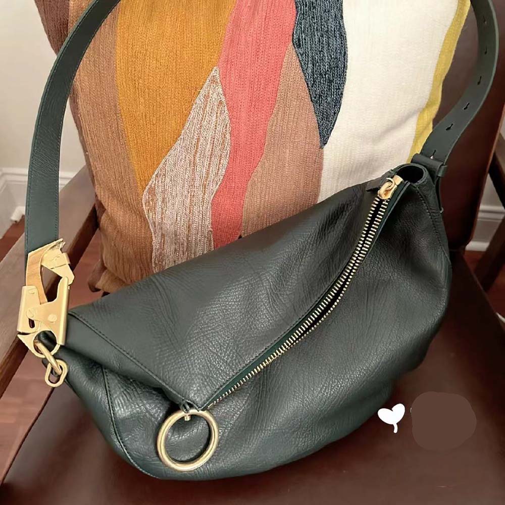 Close-up of gunmetal hardware and Knight emblem on Burberry bag