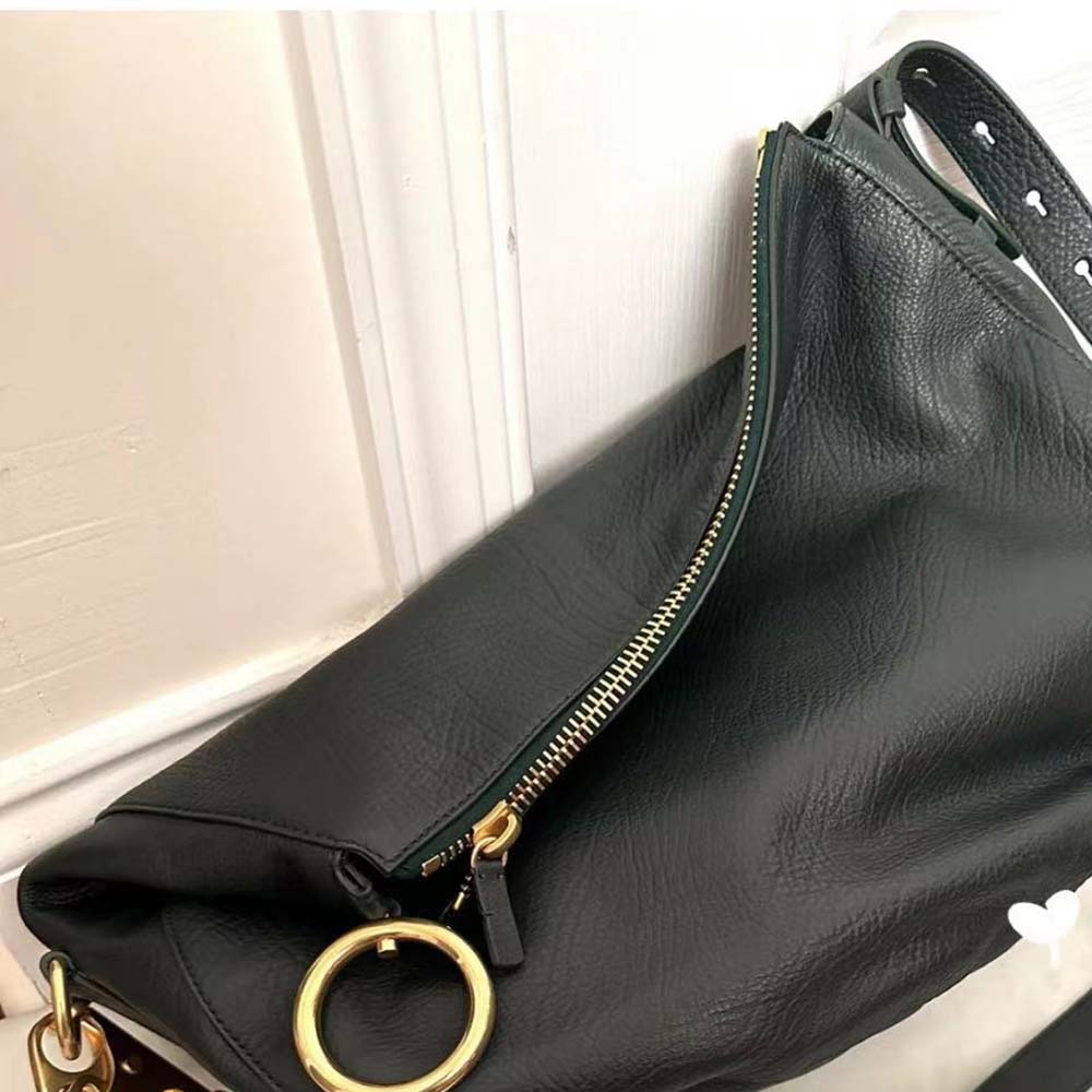 Side profile showing adjustable strap on Burberry Women Small Knight Bag