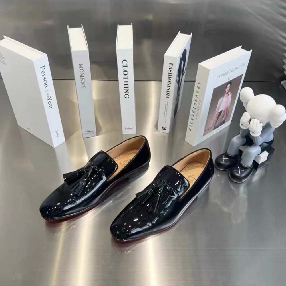 Sole showing signature red lacquer on Christian Louboutin Men Dandelion Tassel Loafers