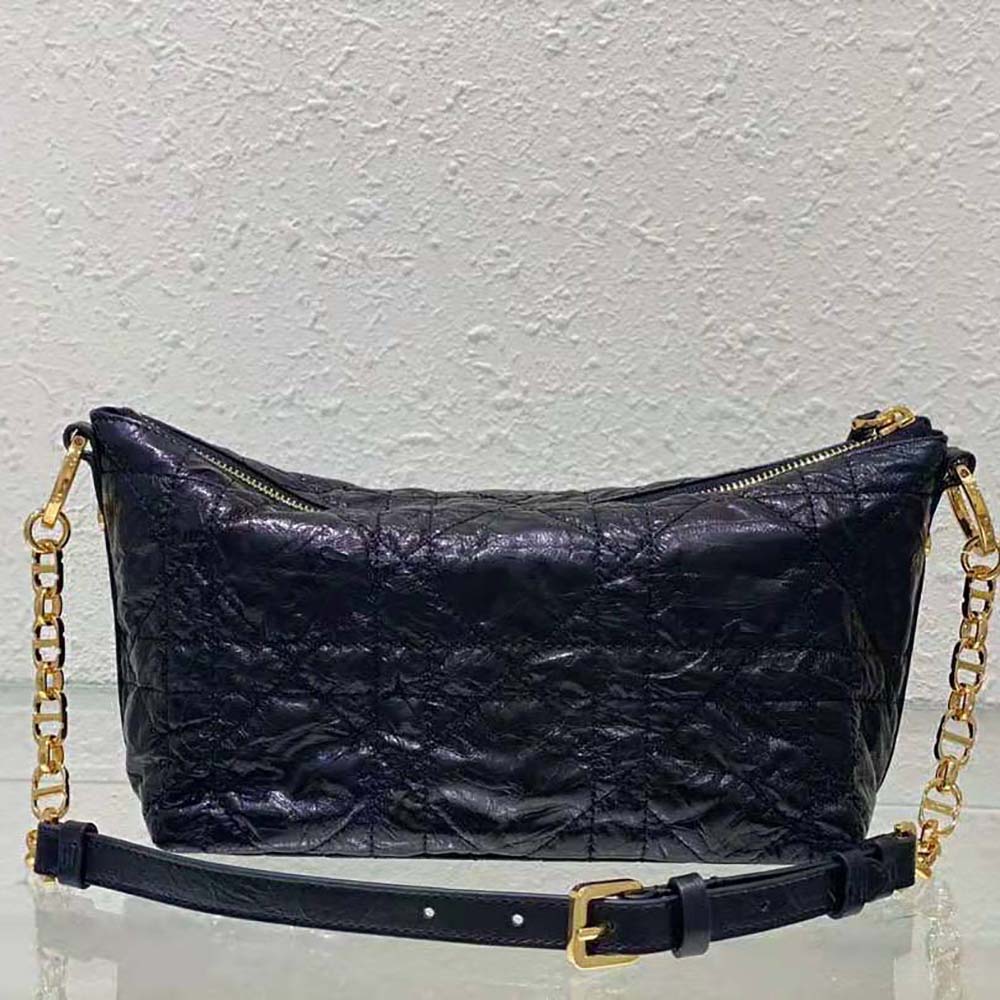 Side angle showing silhouette and leather texture of Dior Women Diorstar Hobo Bag