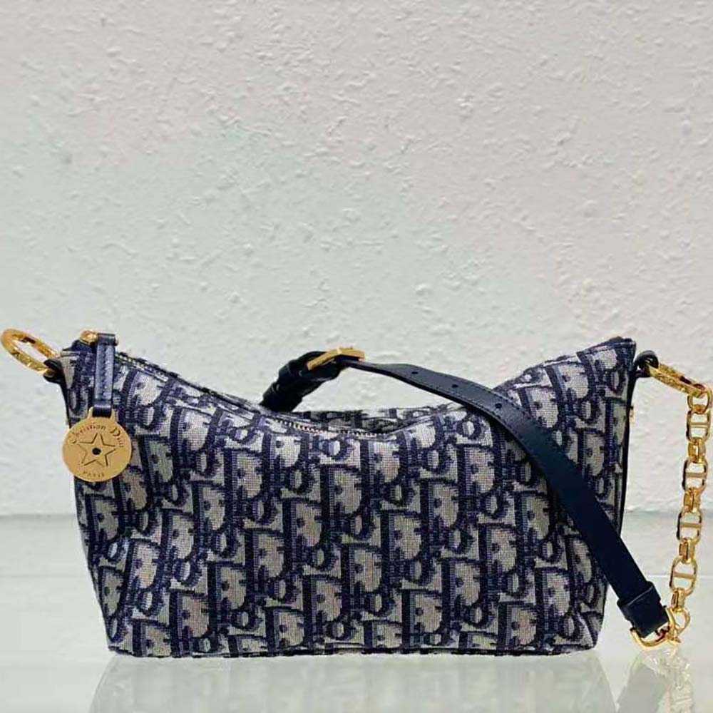 Close-up of silver chain and Dior Oblique jacquard on Diorstar Hobo Bag