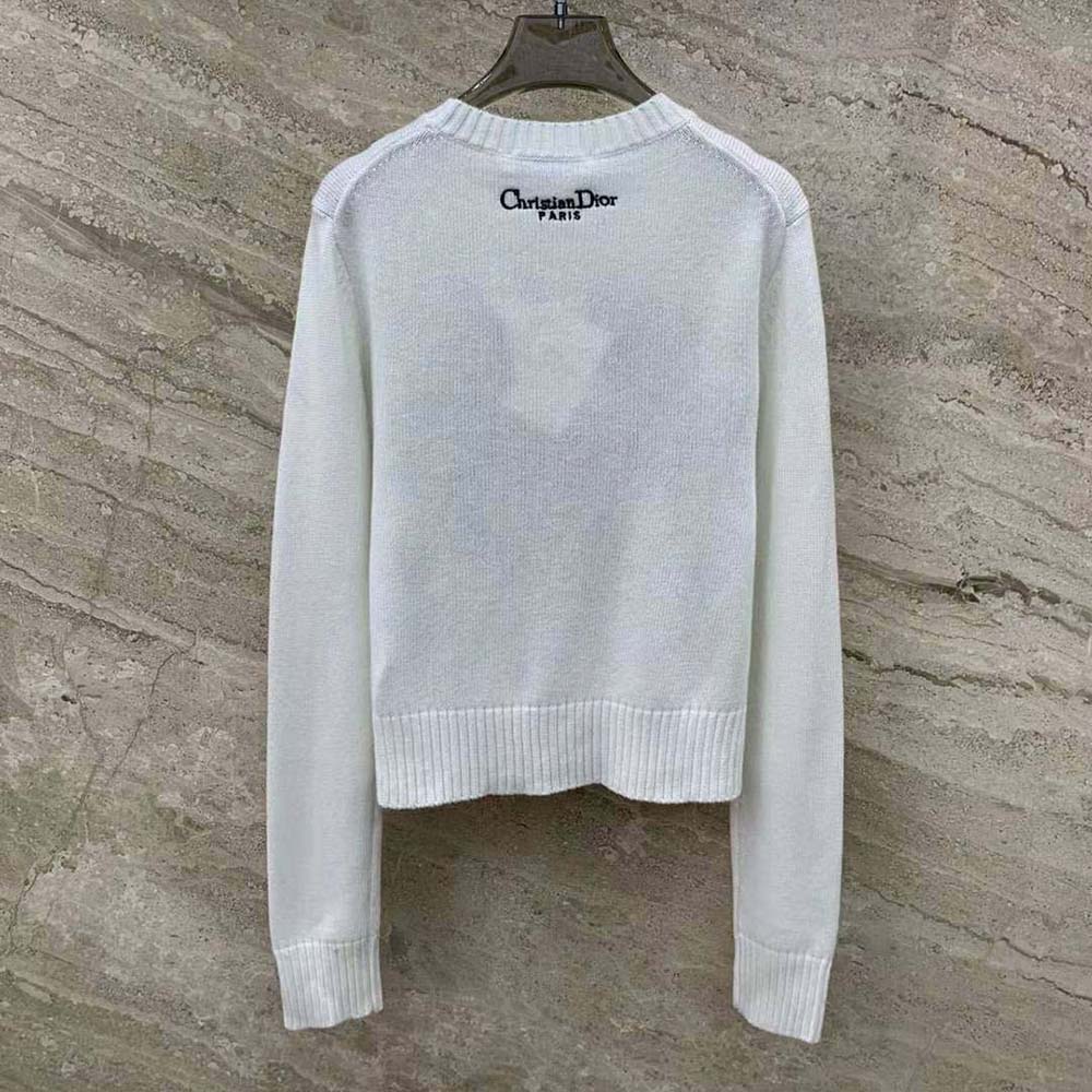 Side angle showing relaxed fit of Dior Women Embroidered Sweater