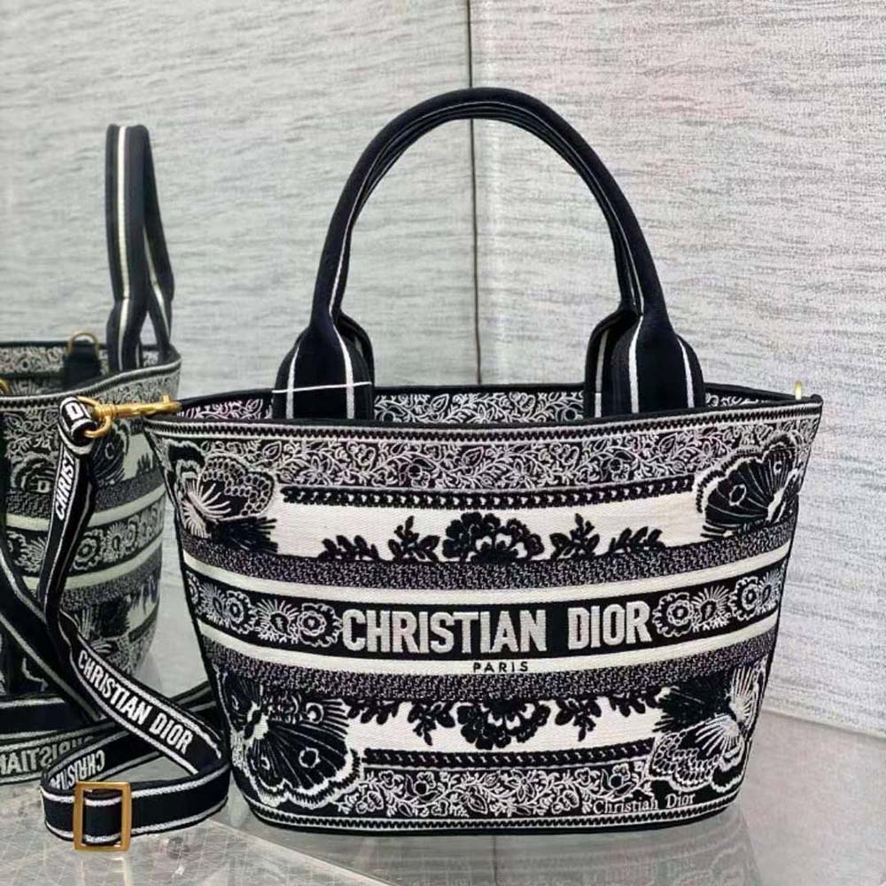Side angle showing silver hardware on Dior Women Hat Basket Bag White and Black Butterfly Bandana Embroidery