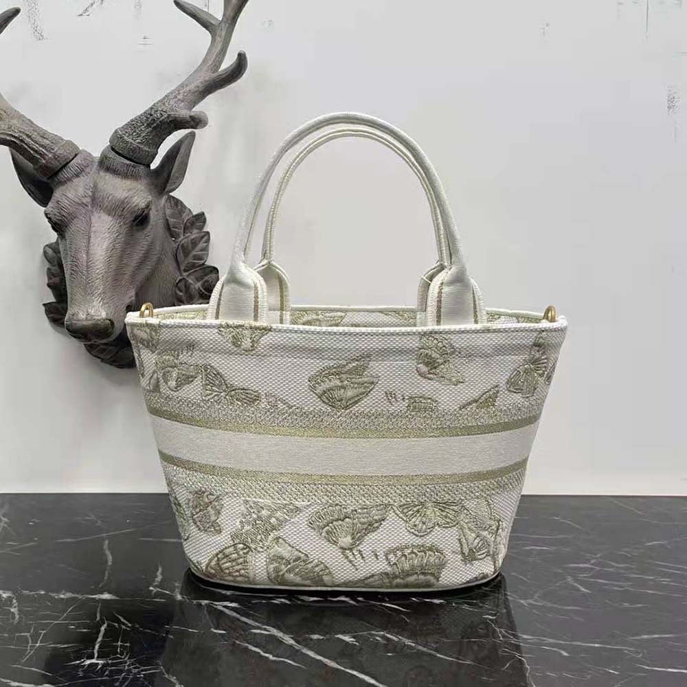 Side angle showing silhouette and gold hardware of Dior Women Hat Basket Bag White