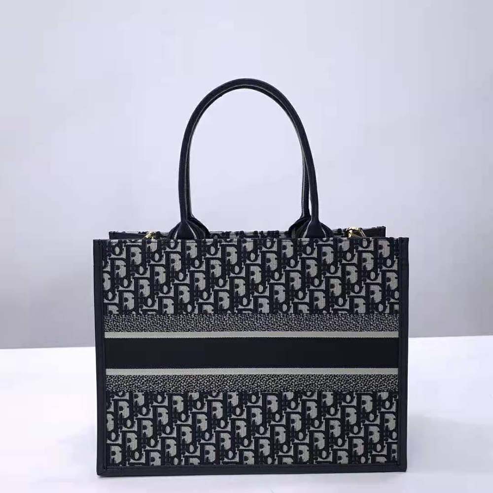 Side angle showing silver-tone hardware on Dior Women Medium Dior Book Tote