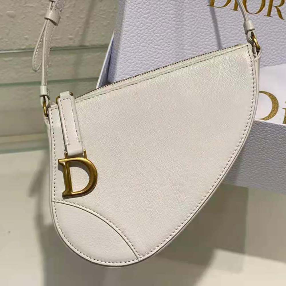 Side angle showing curved silhouette of Dior Women Saddle Shoulder Pouch Latte Goatskin