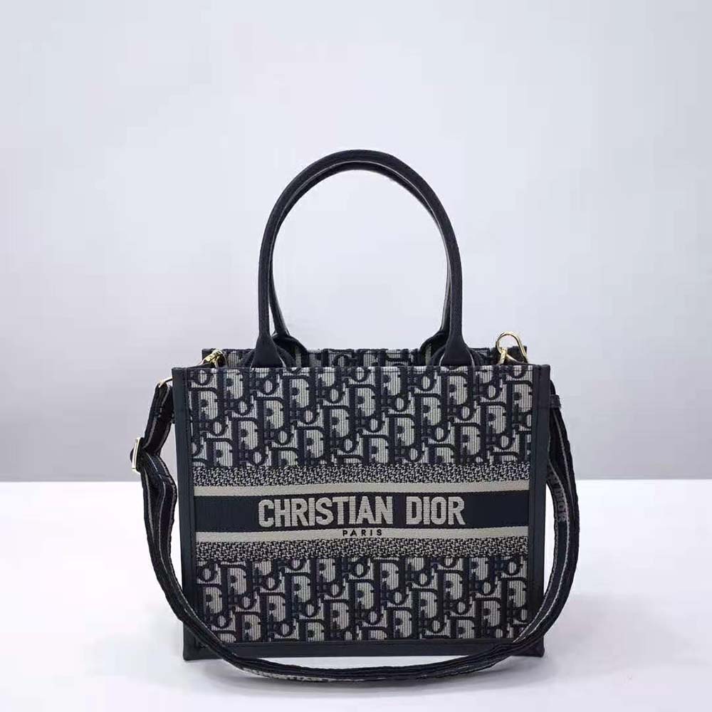 Close-up on blue Dior Oblique embroidery and silver hardware details