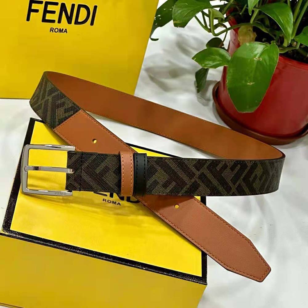Close-up of Fendi Diagonal Belt beige leather texture and gold buckle