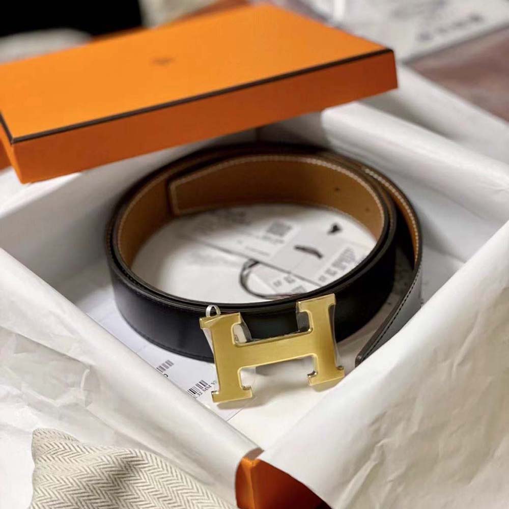 Close-up of silver H buckle on Hermes Men H Belt Buckle & Reversible Leather Strap