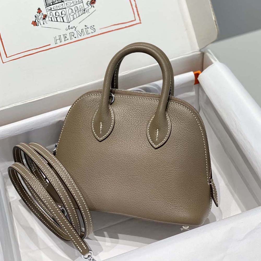 Side view showing structured silhouette and zipper of Hermes Unisex Bolide 1923 Bag