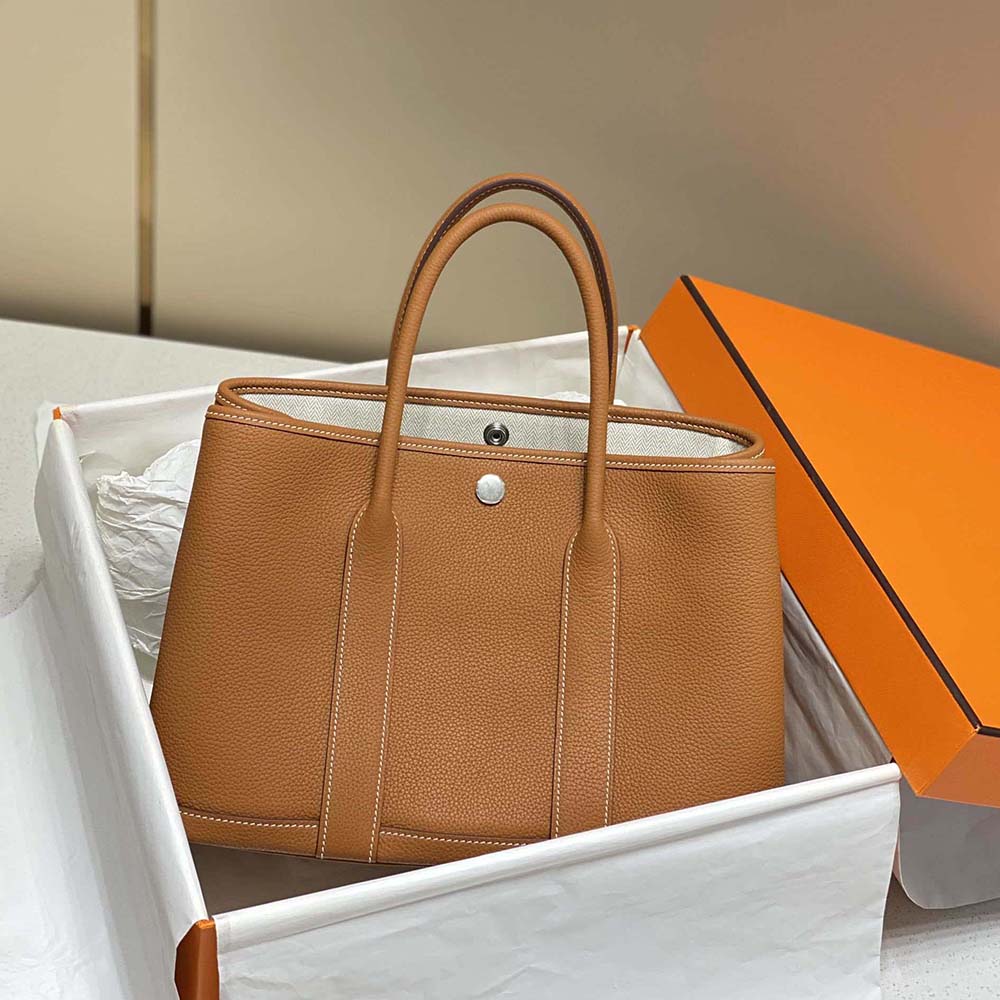 Side angle showing spacious interior of Hermes Garden Party bag