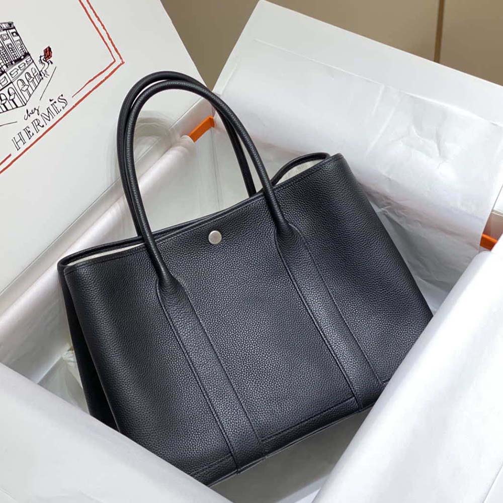 Side angle showing spacious interior of Hermes Unisex Garden Party 36 Voyage Bag-Black