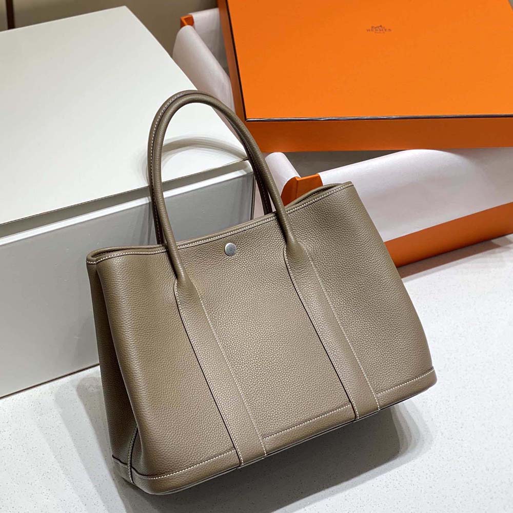 Close-up of silver-tone hardware on Hermes Unisex Garden Party 36 Voyage Bag-Gray