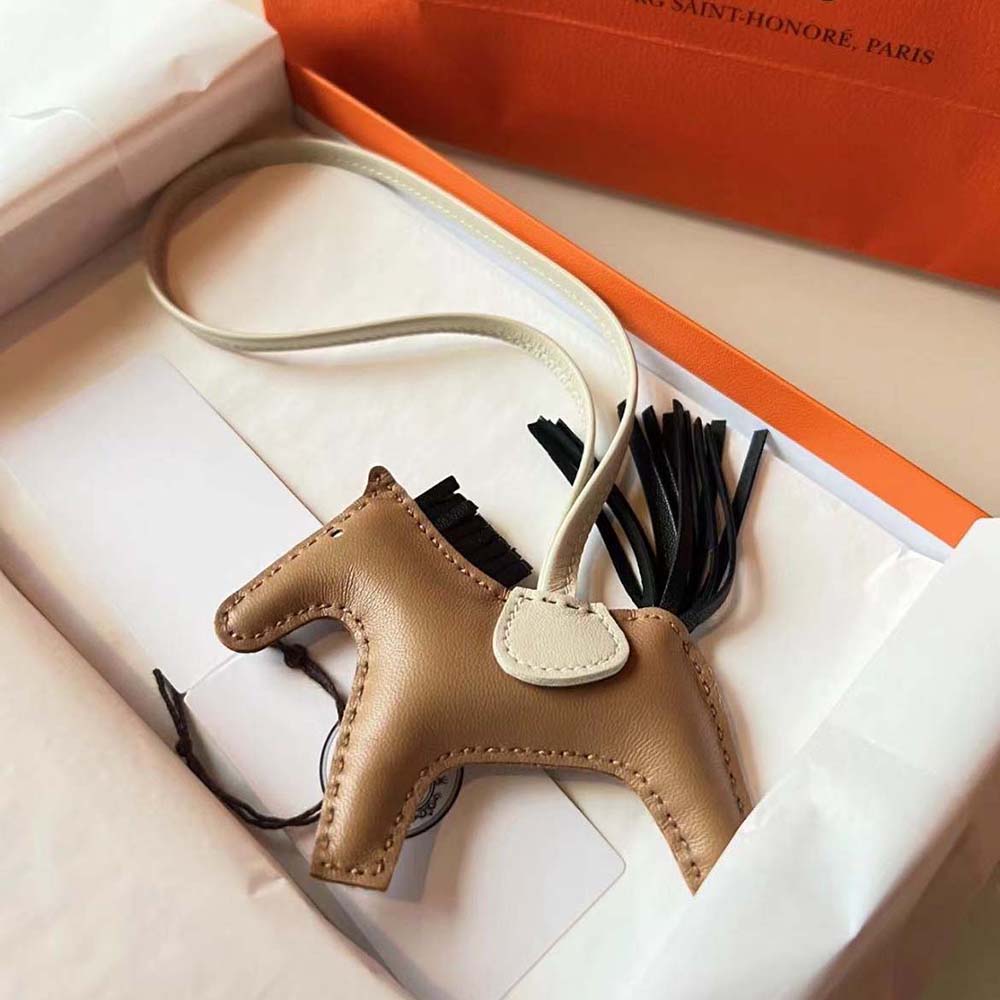 Side view of Hermes Unisex Rodeo MM Charm-Brown with brass hardware