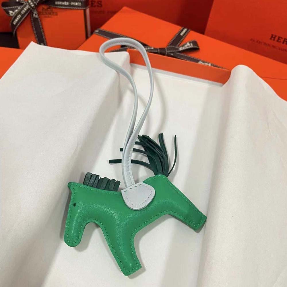 Close-up of green calfskin leather detail on Hermes Rodeo MM Charm