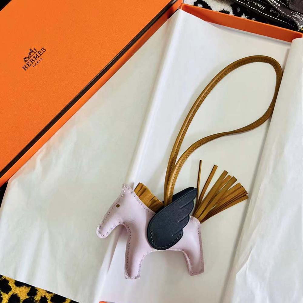 Close-up detail of signature horsebit hardware on Hermes Rodeo Pegase MM Charm-Pink