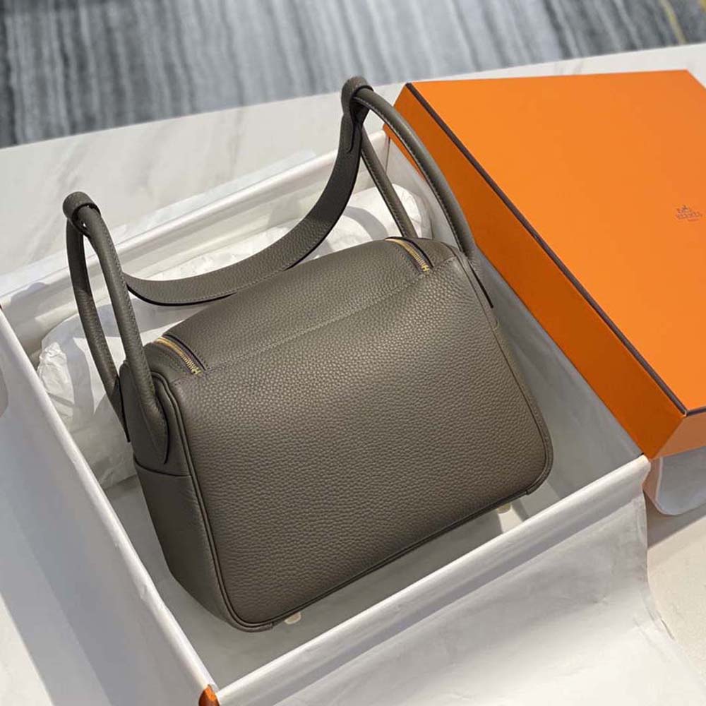Side angle showing relaxed silhouette of Hermes Women Lindy 26 handbag